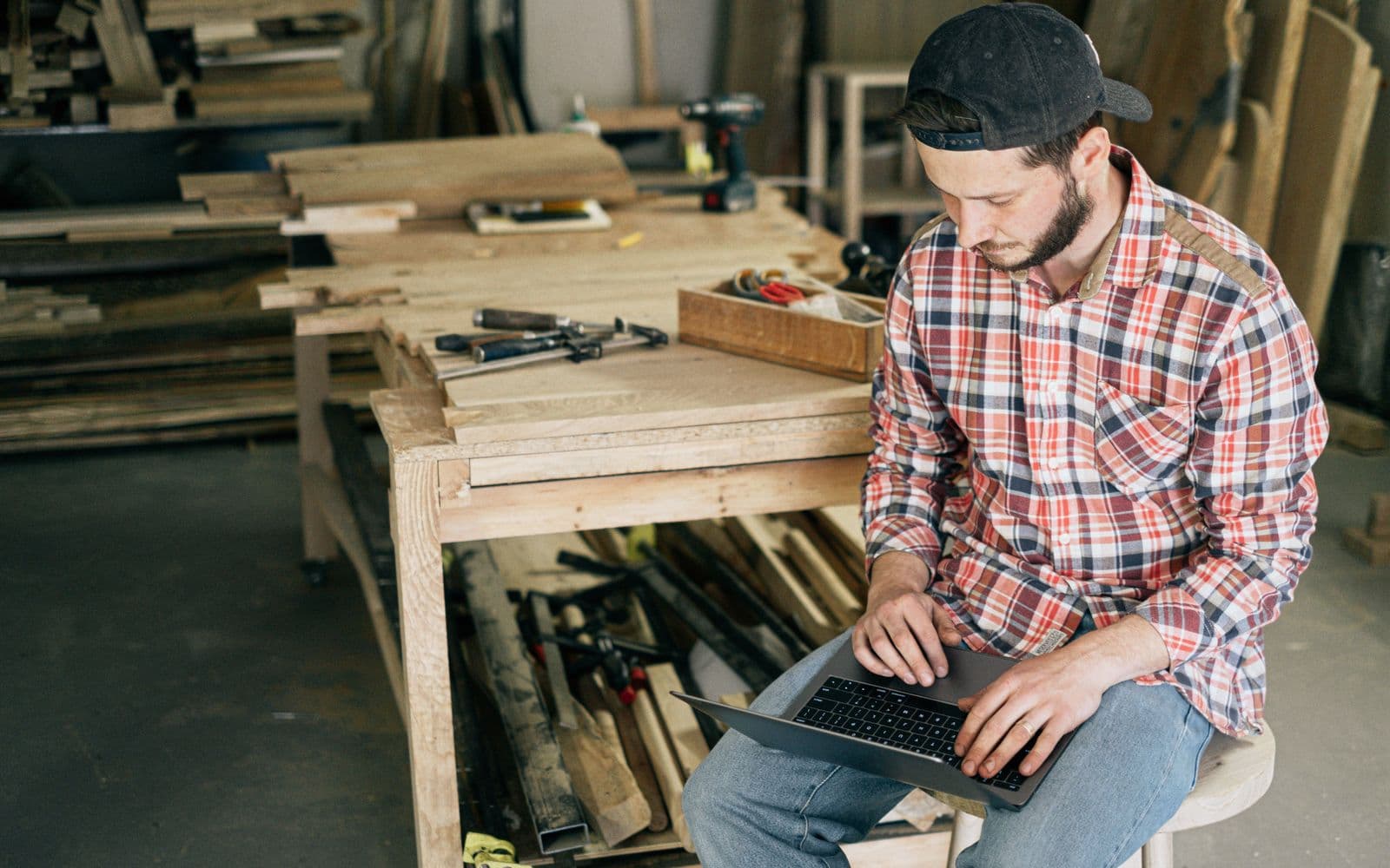 A business owner working at the bench in their own workshop