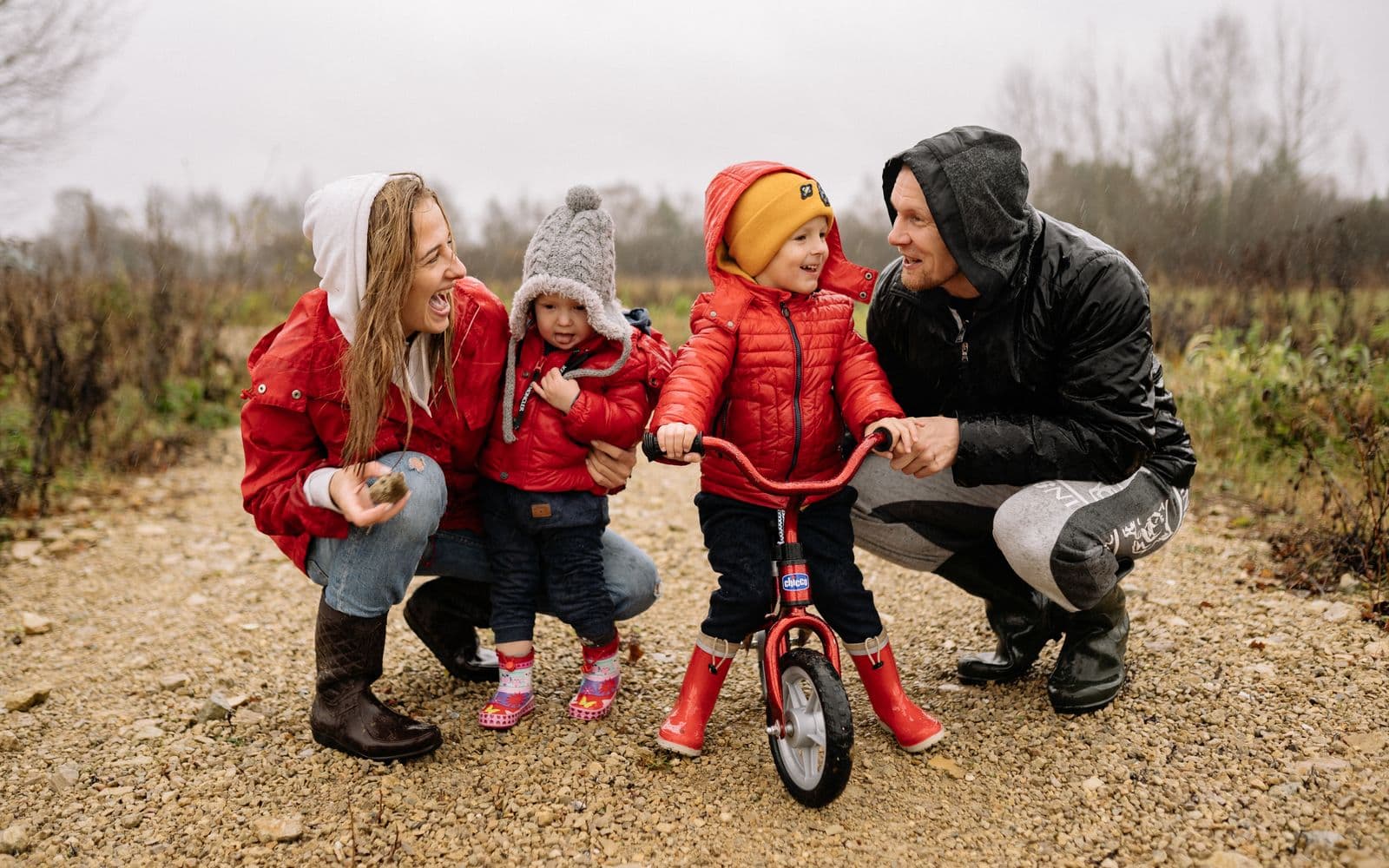 Parents outdoors with their children on a bright autumn afternoon